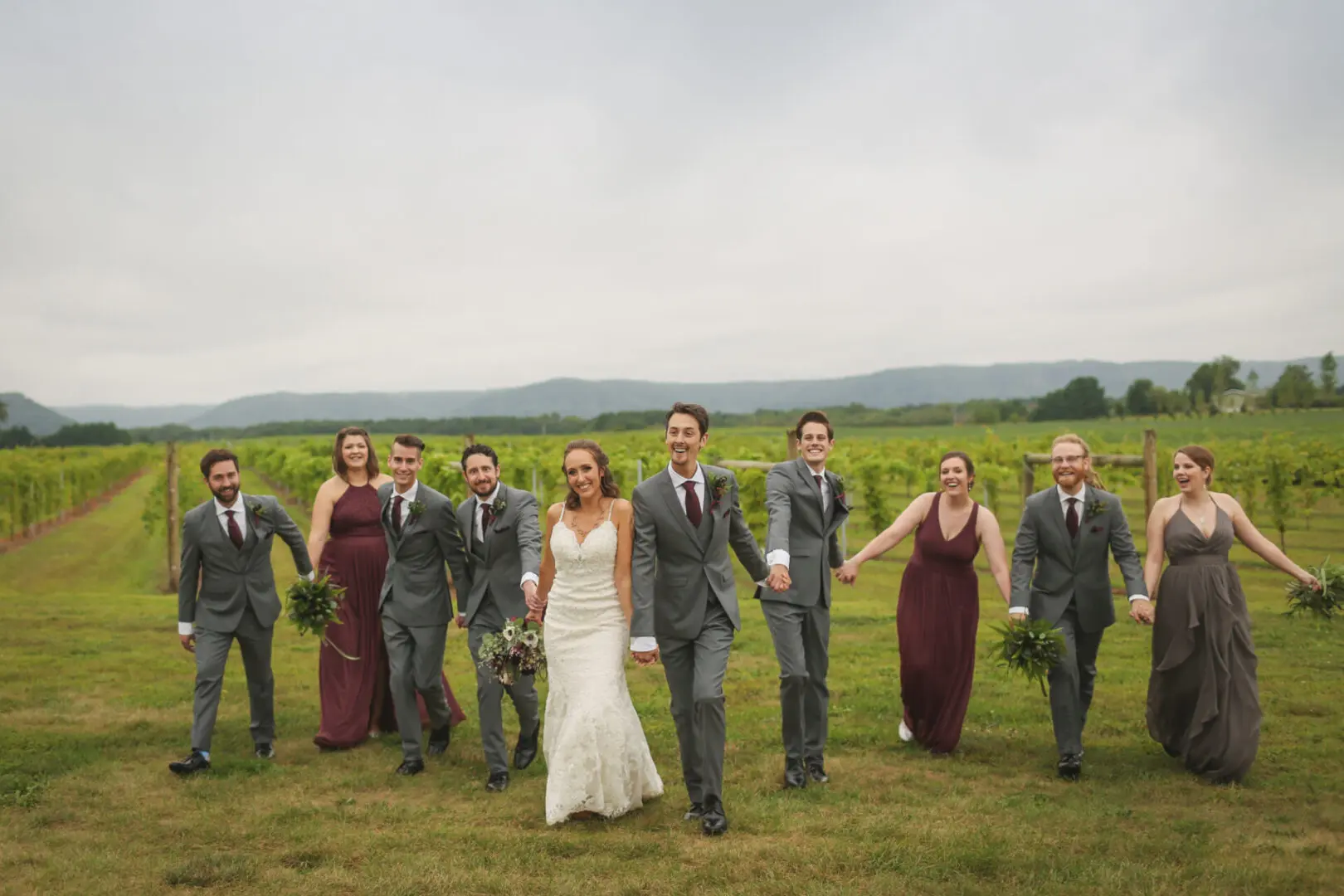 A bride and groom with their bridesmaids and groomsmen