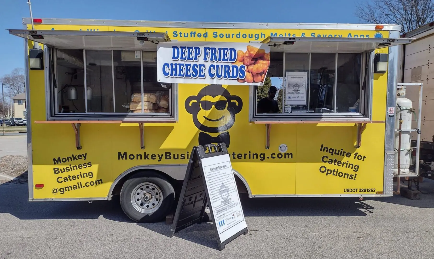 Yellow food truck with deep fried cheese curds.